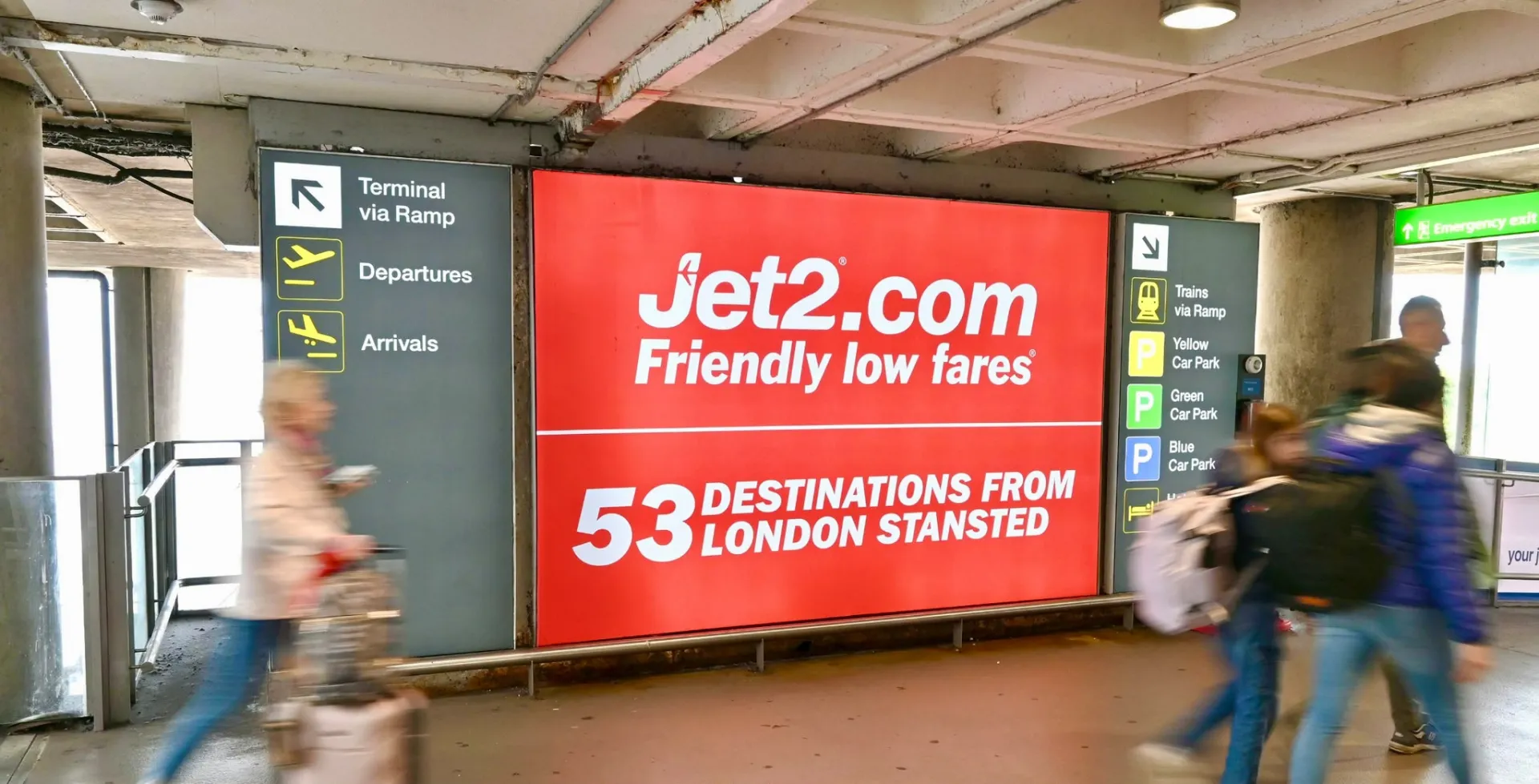 Airport terminal advertising in a UK departure lounge